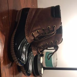 Tan and black duck boots